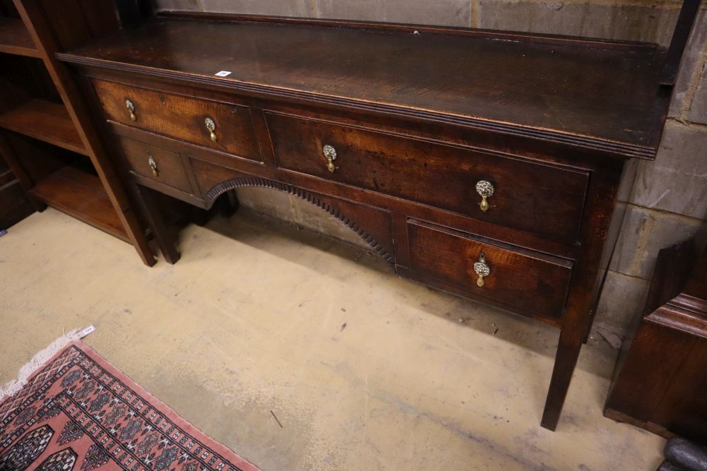 A 19th century oak dresser with open plate rack, width 152cm, depth 41cm, height 181cm